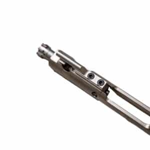 Close-up of a precision-engineered firearm bolt carrier group in a sleek, metallic finish, showcasing craftsmanship and reliability.