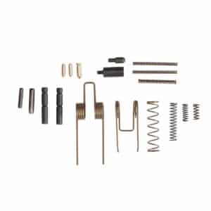 Collection of firearm components including springs, pins, and small parts, showcasing quality craftsmanship and reliability.