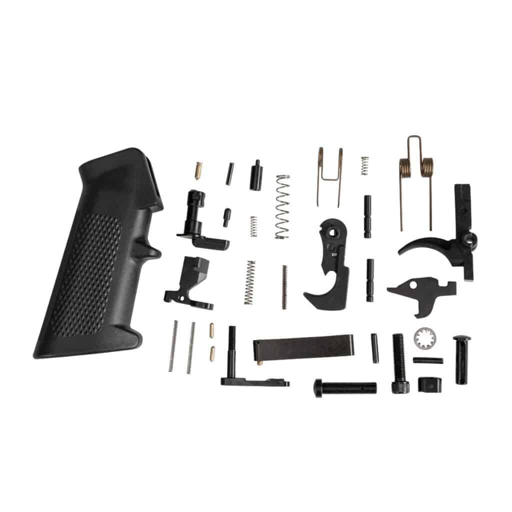 Collection of firearm parts including a black pistol grip, springs, and various metal components for assembly.