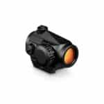 Compact black reflex sight with an orange lens, featuring adjustable brightness and a durable design for reliable performance.