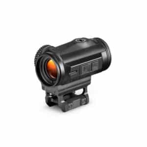 Close-up of a black tactical rifle scope with an orange lens and adjustable settings, mounted securely.
